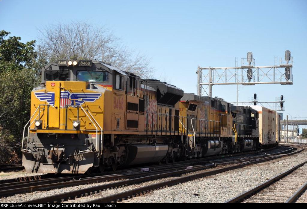 Eastbound manifest rolls past the station